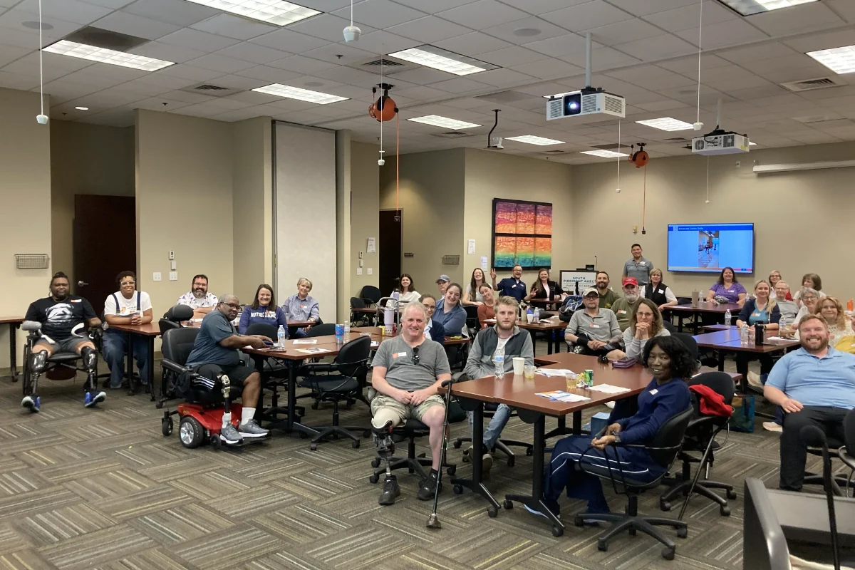 AWS participants and clinicians together in classroom